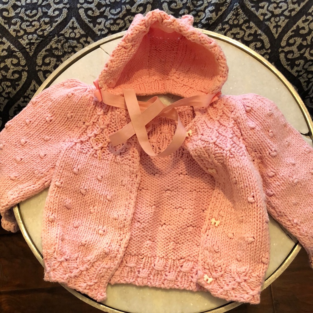 Hand knitted baby sweater with hat with kitty ears.